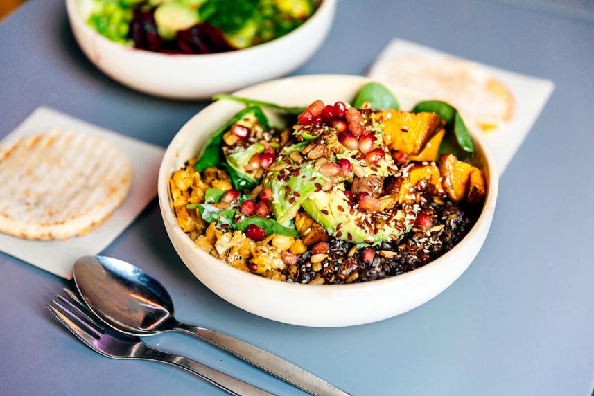 Bowl of salad on blue table