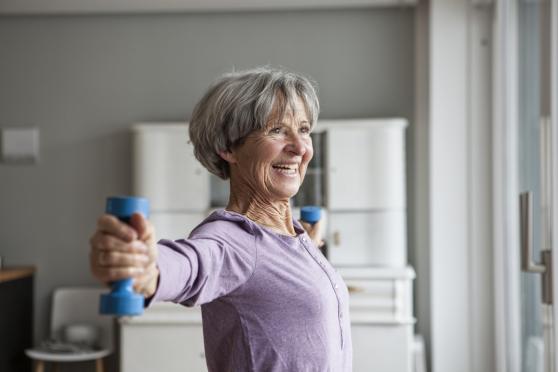 Photo: Woman doing arm workout